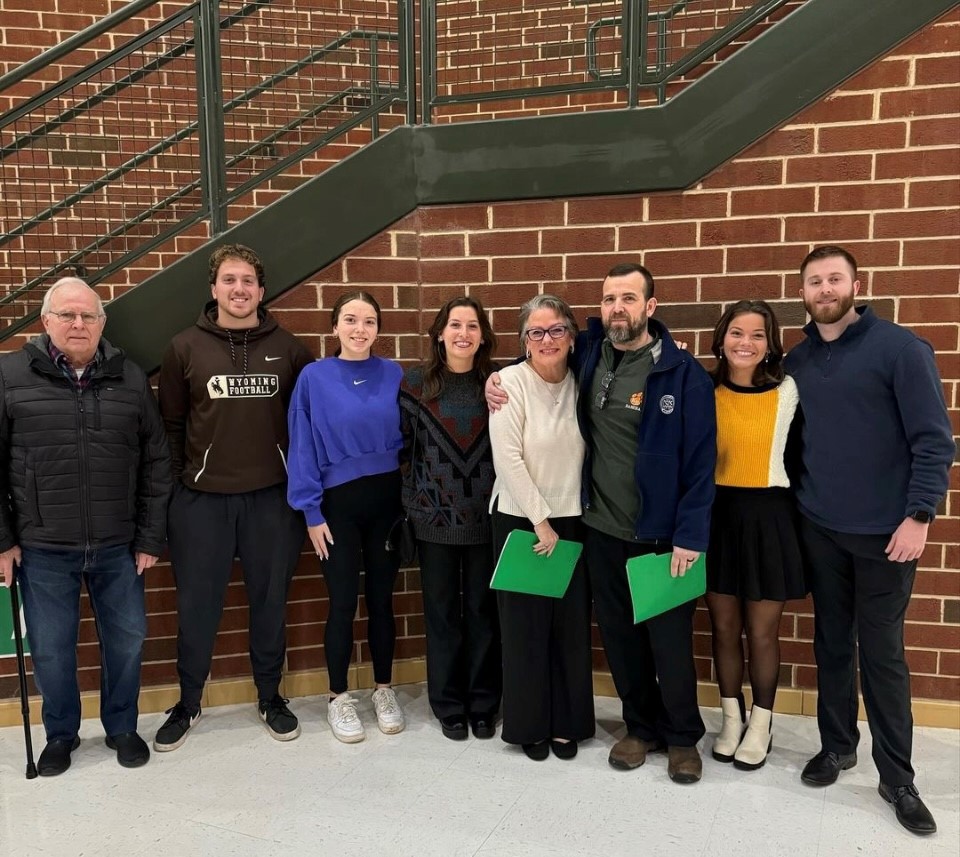 Coach Whis with his family and former students. 